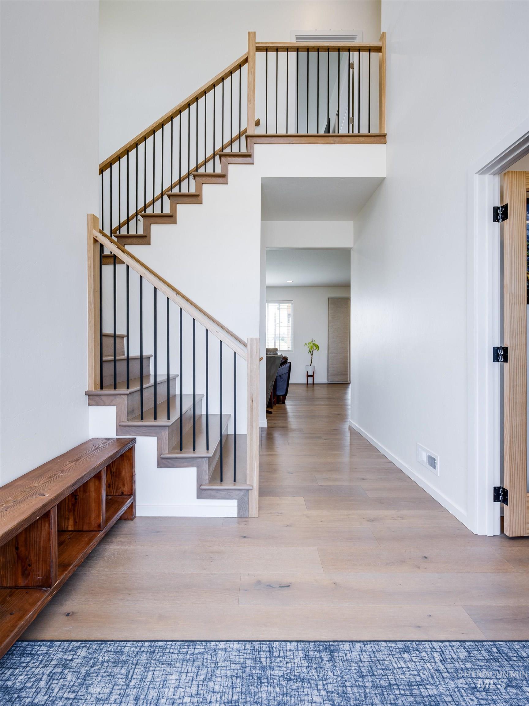 1325 Southwest Panorama Drive Pullman, WA 99163 - Photo 4 of 48 Entrance foyer featuring light wood finished floors, a towering ceiling, and stairway
