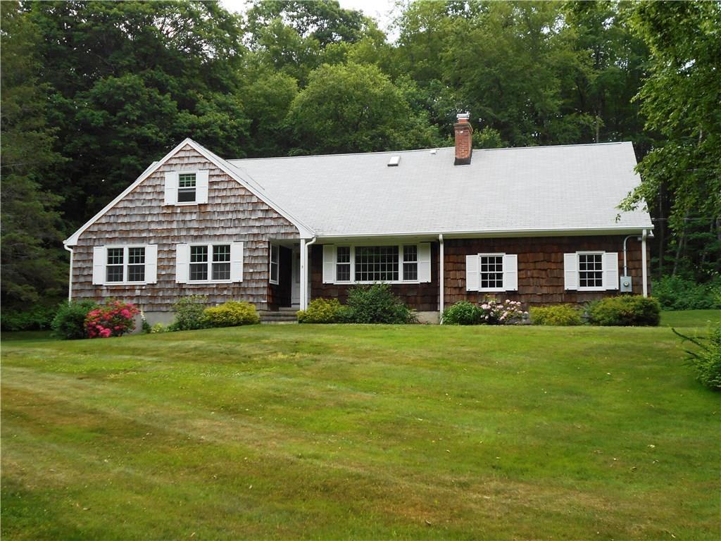 5 Oak Ridge Drive Bethany, CT 06524 - Photo 1 of 1 a front view of a house with a yard