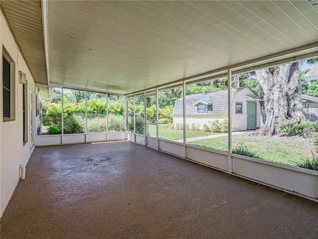 a view of a garden with an outdoor seating