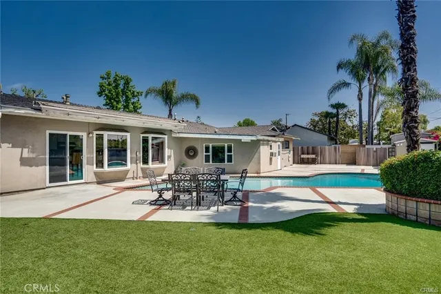 a front view of house with yard and outdoor seating