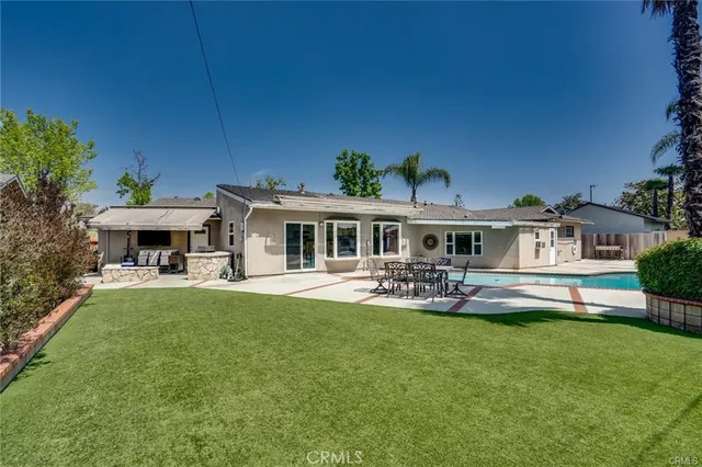 a front view of house with yard and seating area