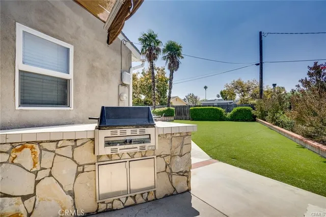a view of a chair and table in the garden