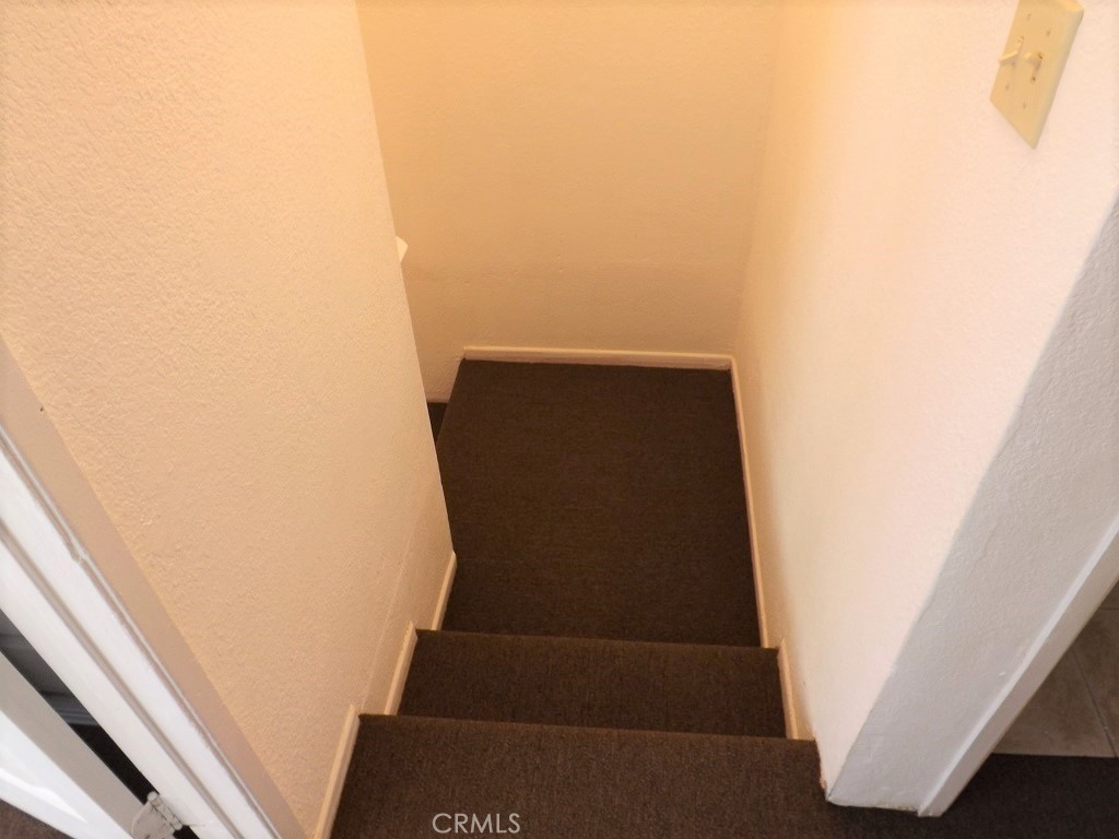 18202 Casaba Road, Unit B Adelanto, CA 92301 - Photo 11 of 32 a view of staircase