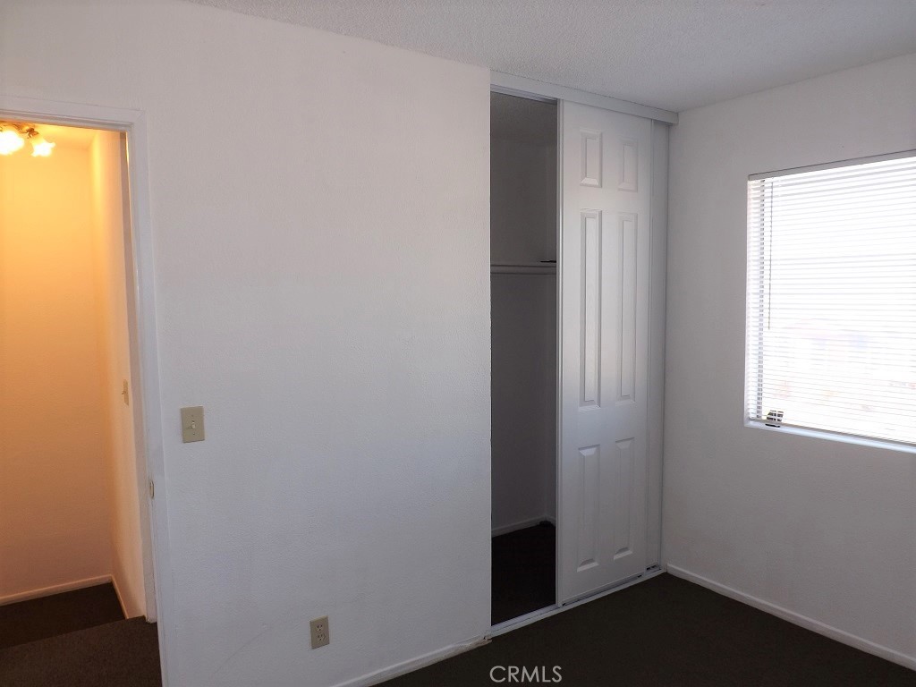 18202 Casaba Road, Unit B Adelanto, CA 92301 - Photo 14 of 32 a view of front door with wooden floor