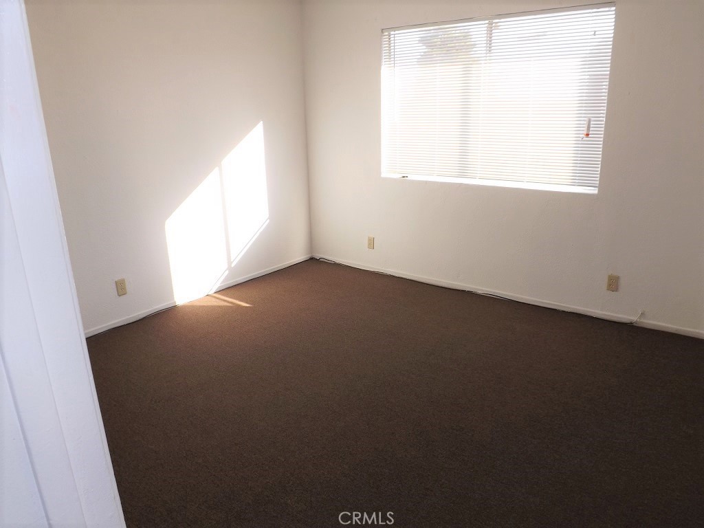 18202 Casaba Road, Unit B Adelanto, CA 92301 - Photo 19 of 32 an empty room with a window