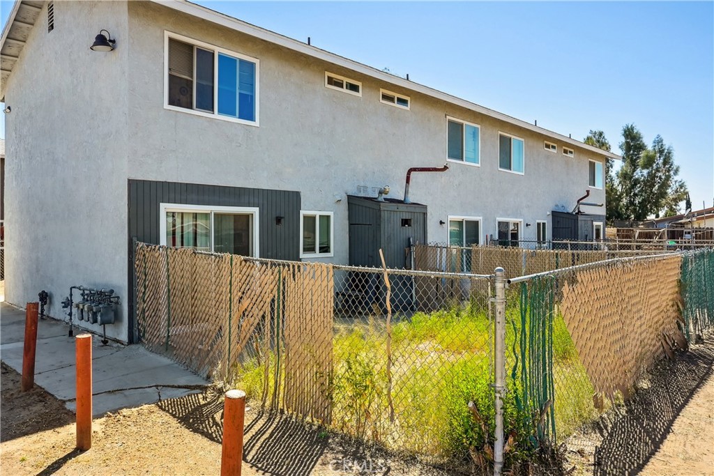18202 Casaba Road, Unit B Adelanto, CA 92301 - Photo 25 of 32 a view of house with swimming pool outdoor seating