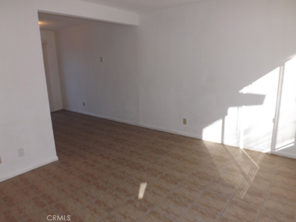 18202 Casaba Road, Unit B Adelanto, CA 92301 - Photo 8 of 32 a view of an empty room with a window