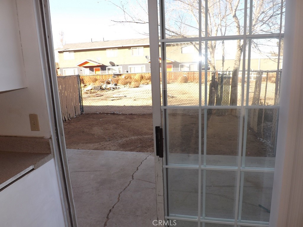 18202 Casaba Road, Unit B Adelanto, CA 92301 - Photo 10 of 32 a bathroom with a glass shower door