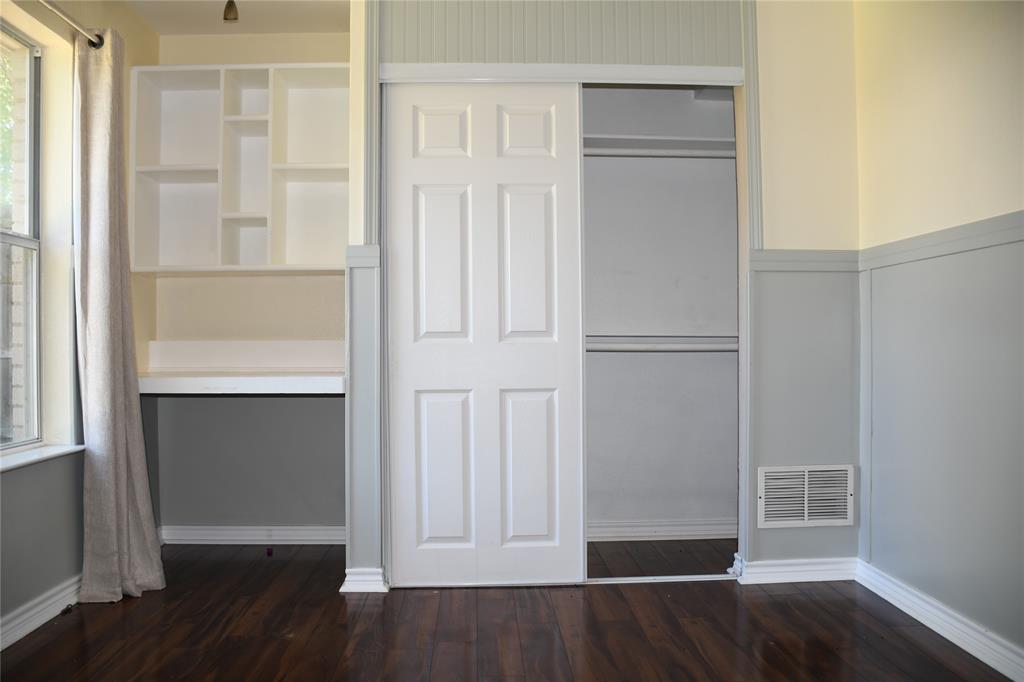 6241 Peach Tree Drive Midlothian, TX 76065 - Photo 12 of 19 Dark wood-finish flooring with white baseboards throughout