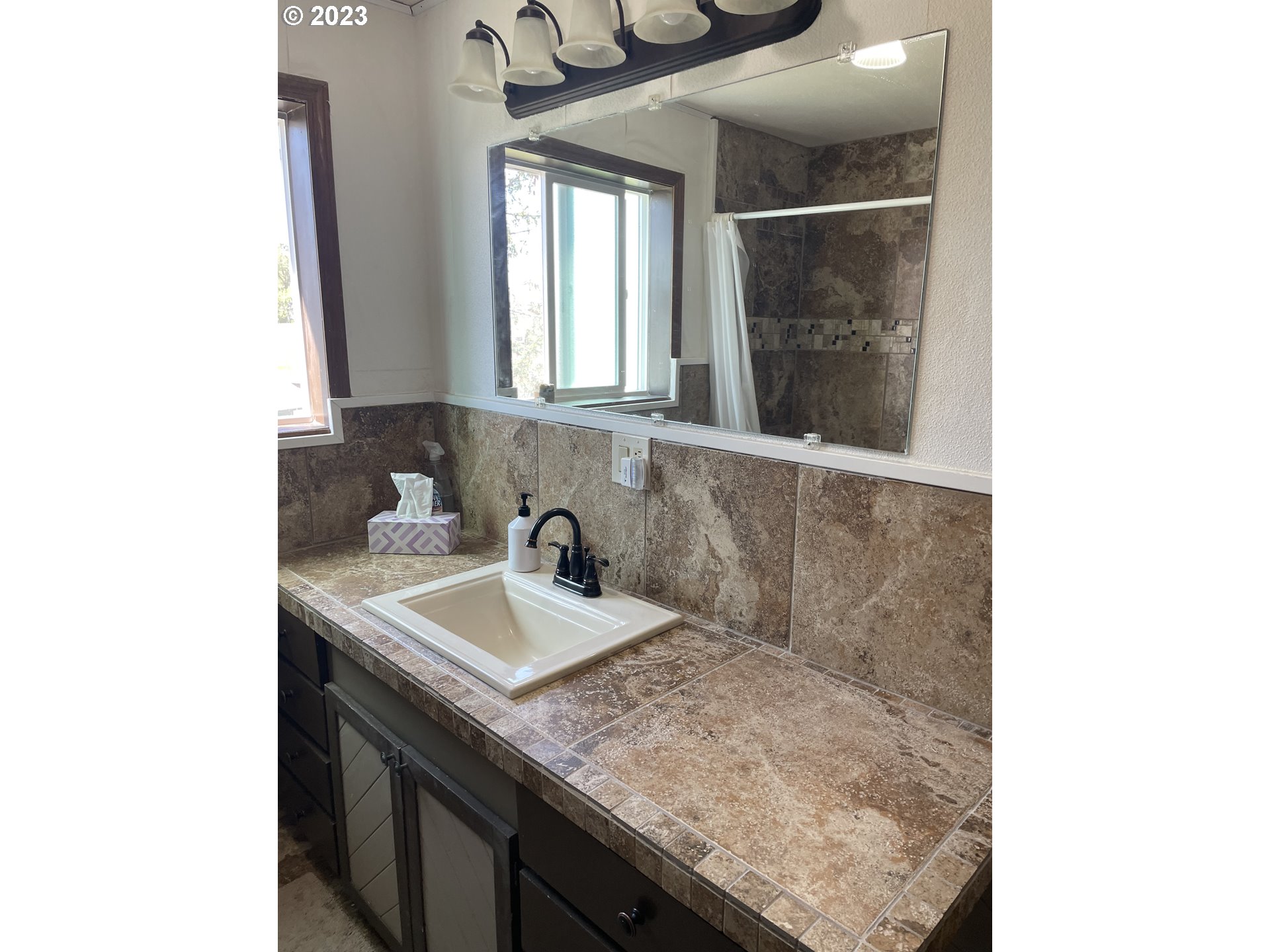 43776 Buckboard Trail Road Pendleton, OR 97801 - Photo 12 of 22 a bathroom with a sink and a mirror