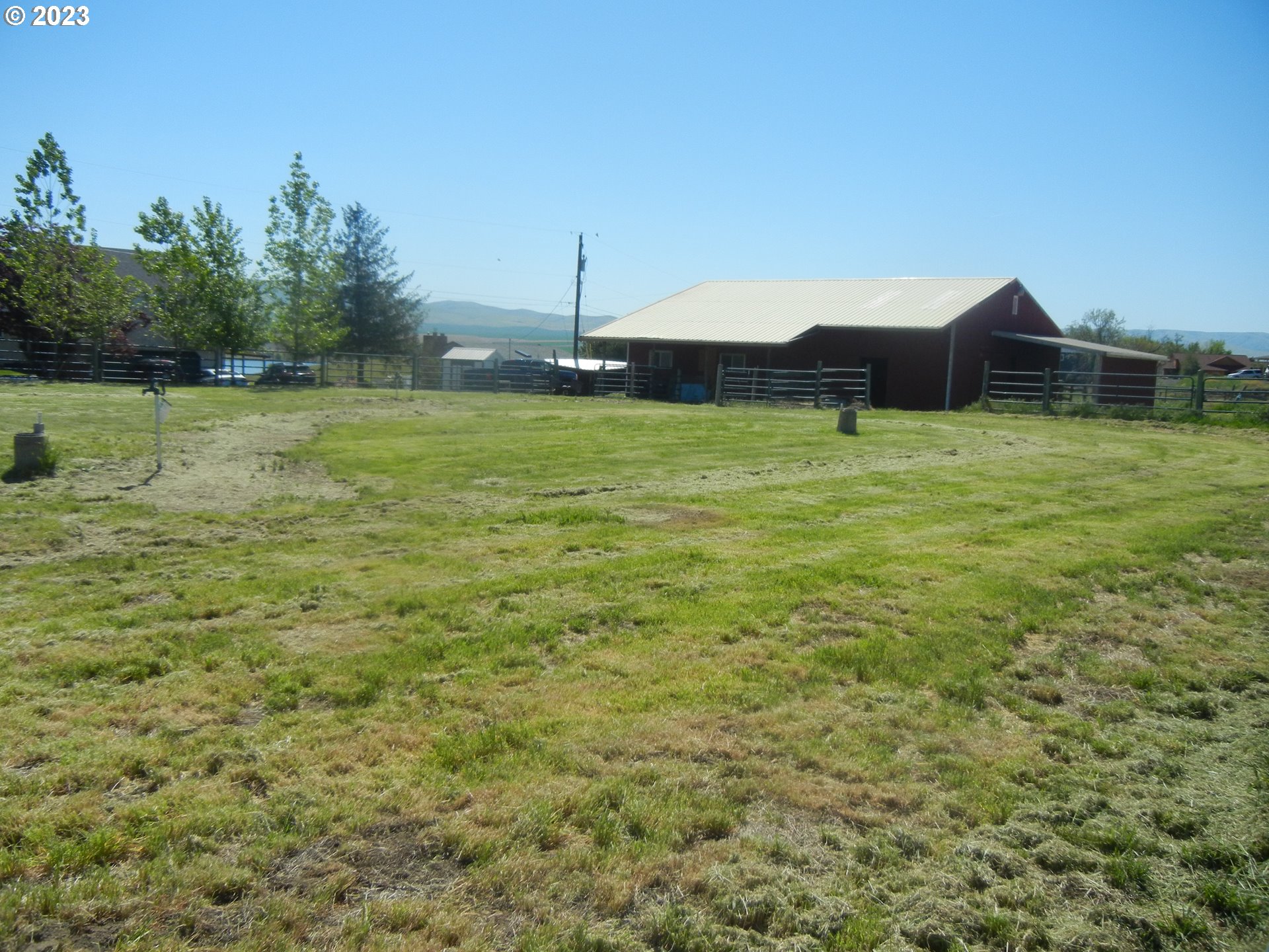 43776 Buckboard Trail Road Pendleton, OR 97801 - Photo 15 of 22 a view of a house with a yard