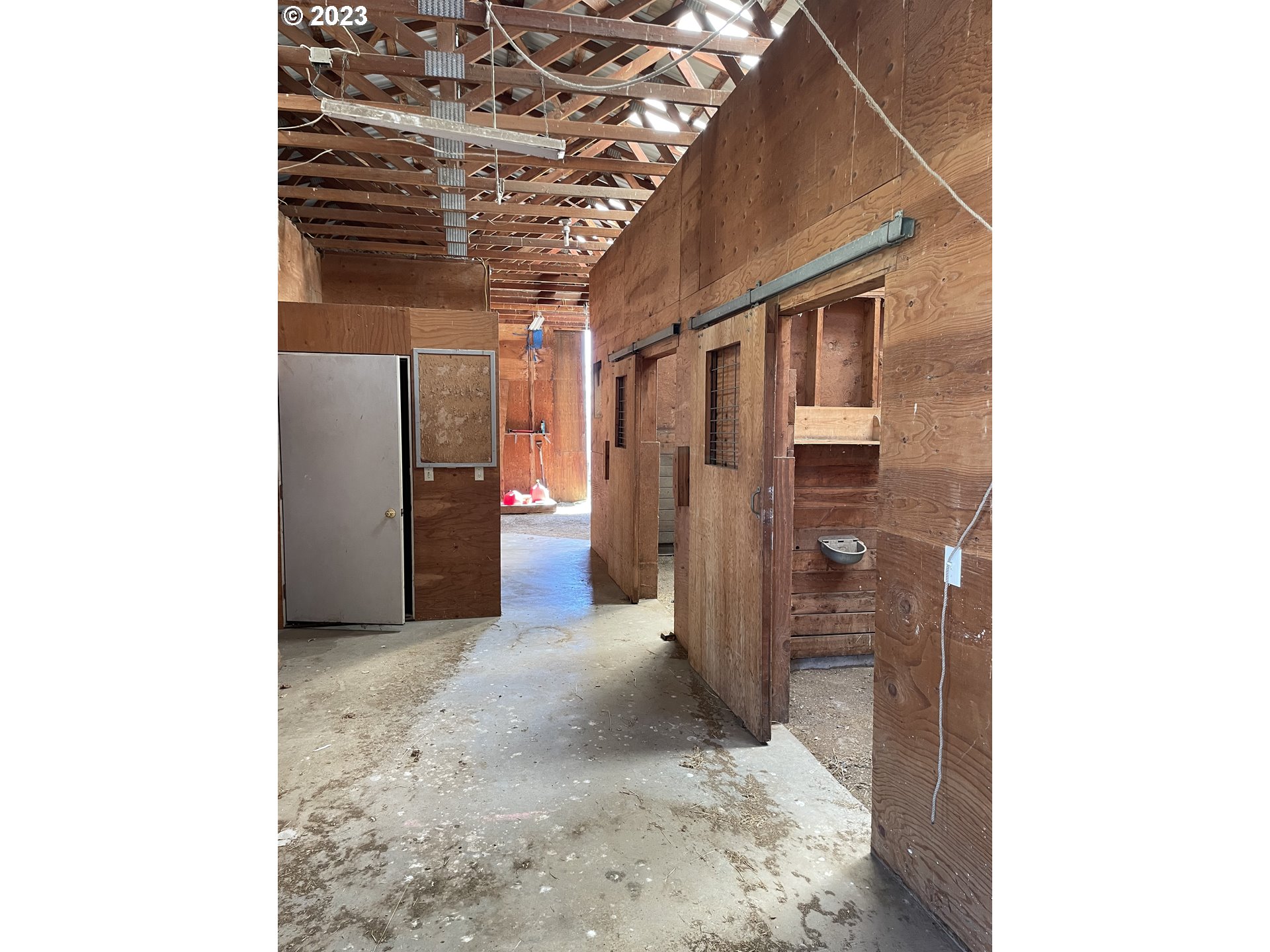 43776 Buckboard Trail Road Pendleton, OR 97801 - Photo 19 of 22 a view of a hallway with wooden walls