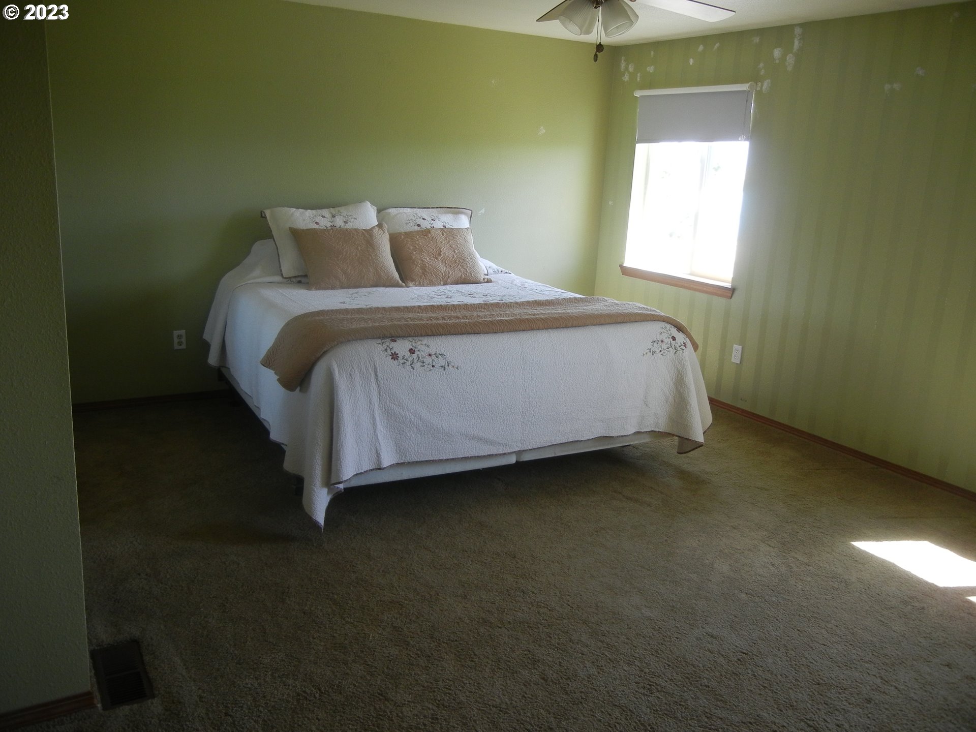 43776 Buckboard Trail Road Pendleton, OR 97801 - Photo 8 of 22 a bed sitting in a bedroom next to a window