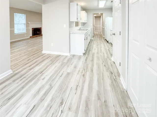 a bathroom with a granite countertop sink a toilet and shower