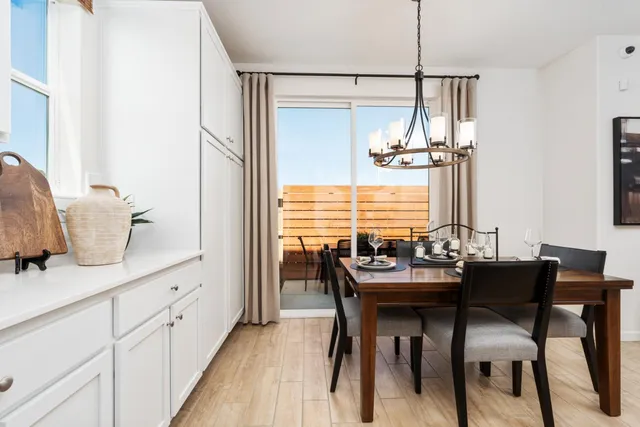 a dining room with furniture and window
