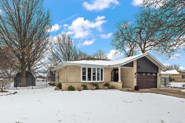 a front view of a house with a dirt yard