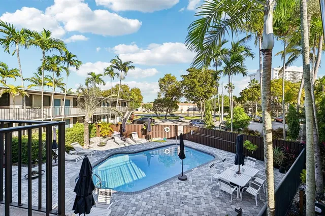 a view of balcony with furniture and garden