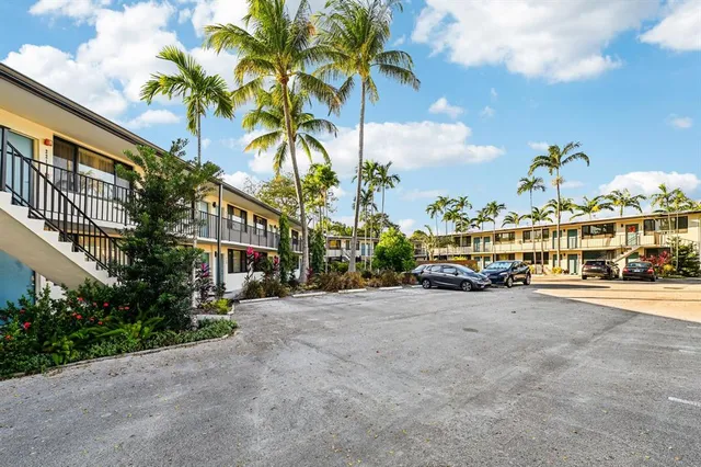 a view of a street with a building in the background