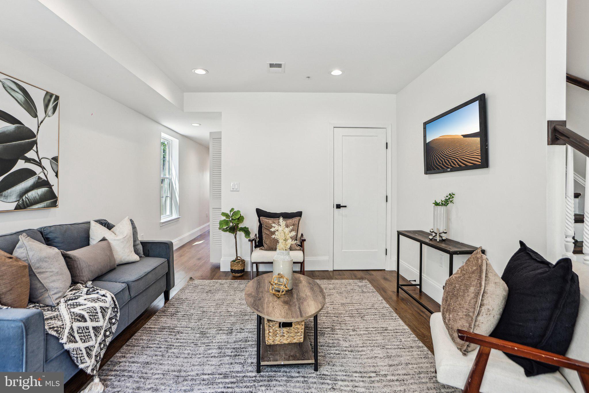 322 56th Street Northeast Washington, DC 20019 - Photo 13 of 57 a living room with furniture and a flat screen tv