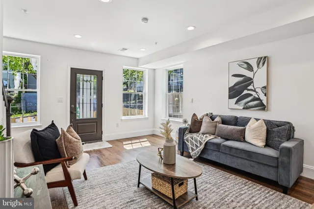 a view of a livingroom with furniture and a table