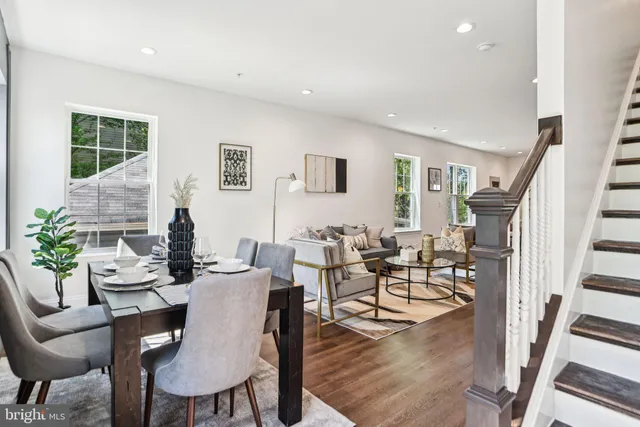 a view of a dining room with furniture window and wooden floor