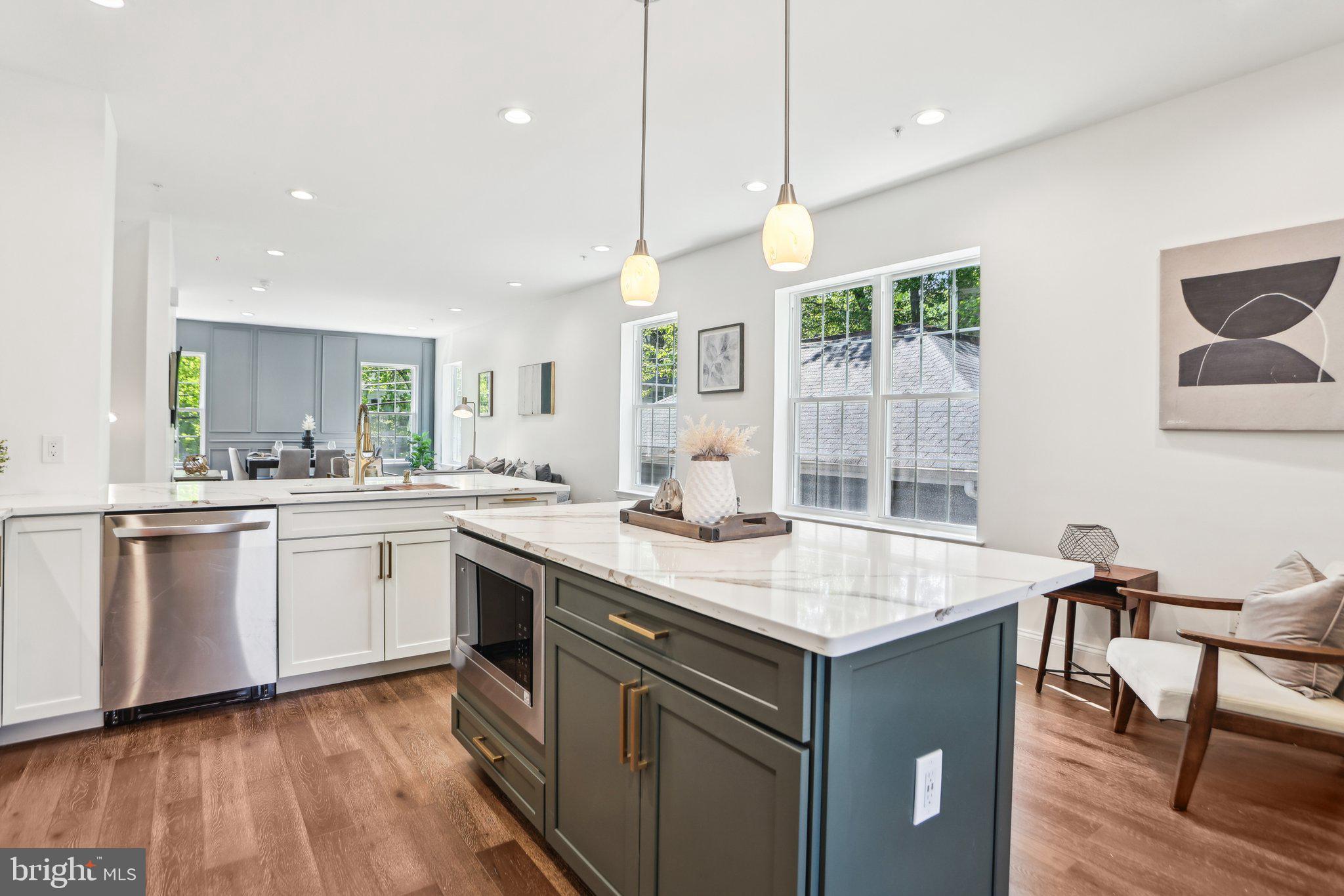 322 56th Street Northeast Washington, DC 20019 - Photo 22 of 57 a kitchen with a stove a sink a dining table and chairs