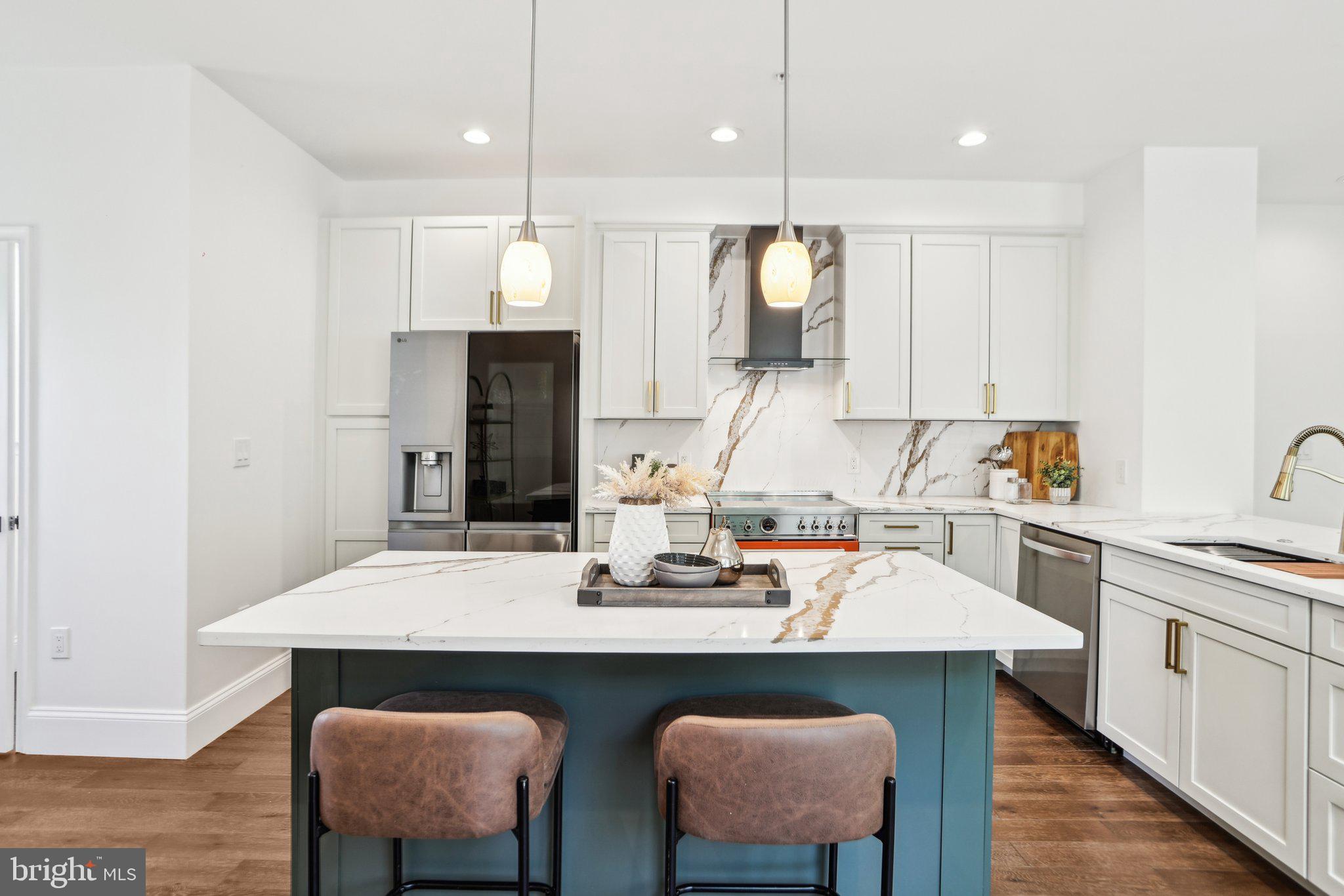 322 56th Street Northeast Washington, DC 20019 - Photo 23 of 57 a kitchen with a dining table chairs and refrigerator