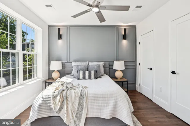 a bathroom with a granite countertop sink toilet and bathtub