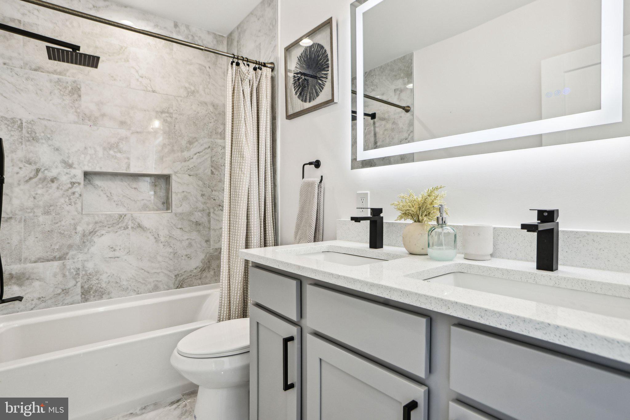 322 56th Street Northeast Washington, DC 20019 - Photo 29 of 57 a bathroom with a granite countertop sink toilet and shower