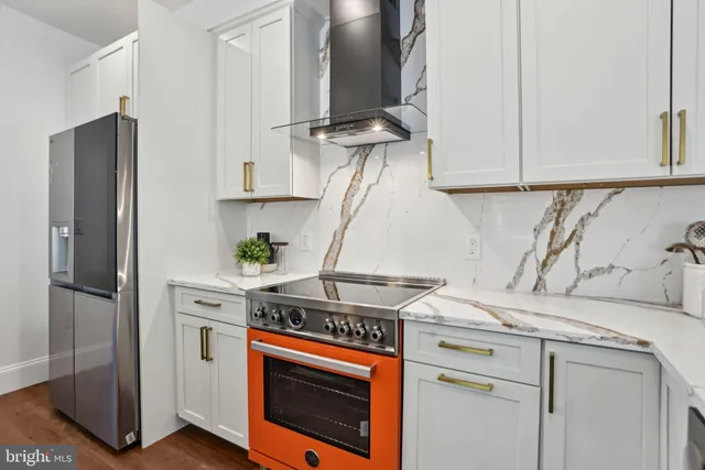 front view of a house with a tree