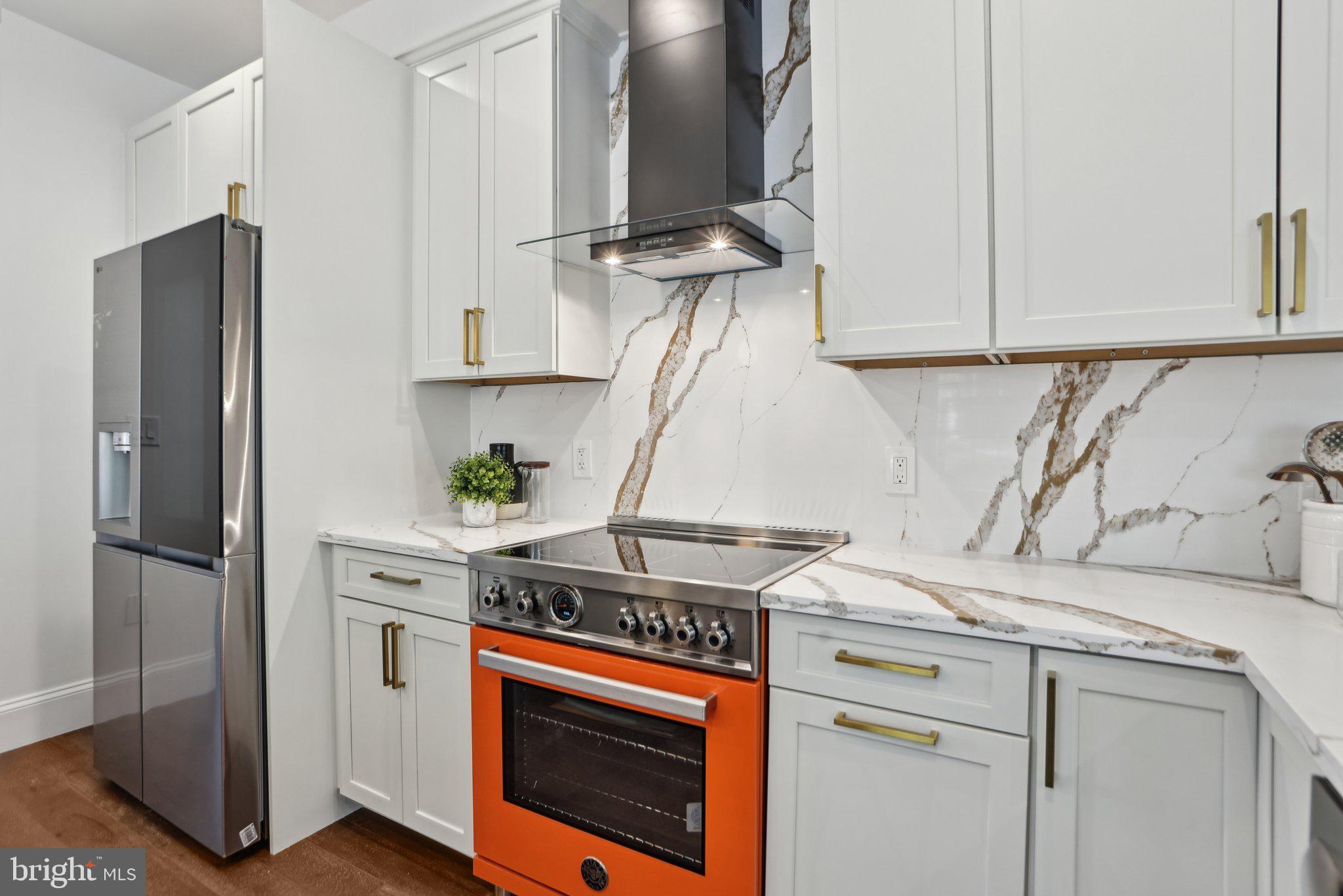 322 56th Street Northeast Washington, DC 20019 - Photo 3 of 57 a kitchen with stainless steel appliances granite countertop a refrigerator and a stove