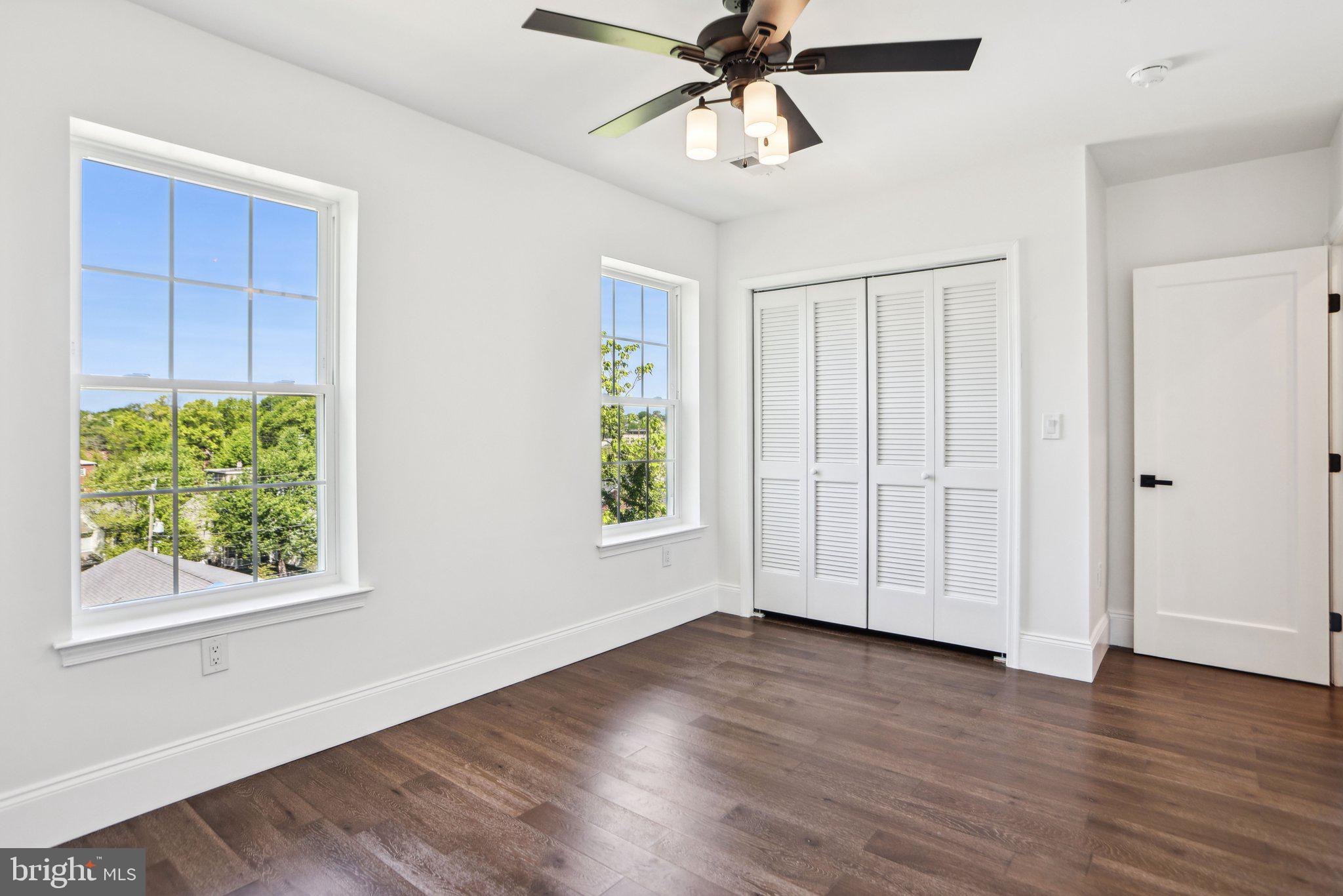 322 56th Street Northeast Washington, DC 20019 - Photo 35 of 57 a view of empty room with wooden floor and fan
