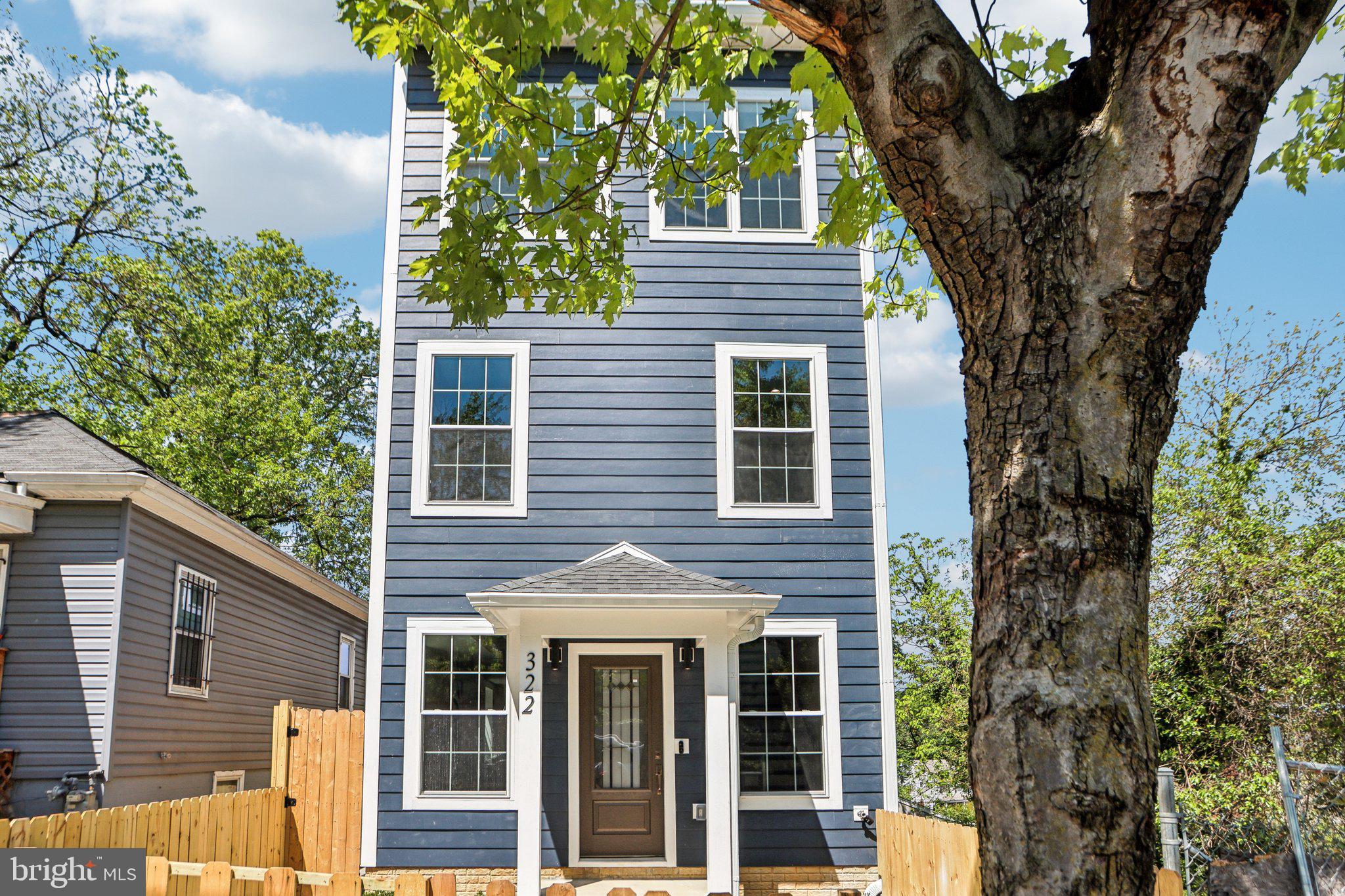 322 56th Street Northeast Washington, DC 20019 - Photo 4 of 57 front view of a house with a tree