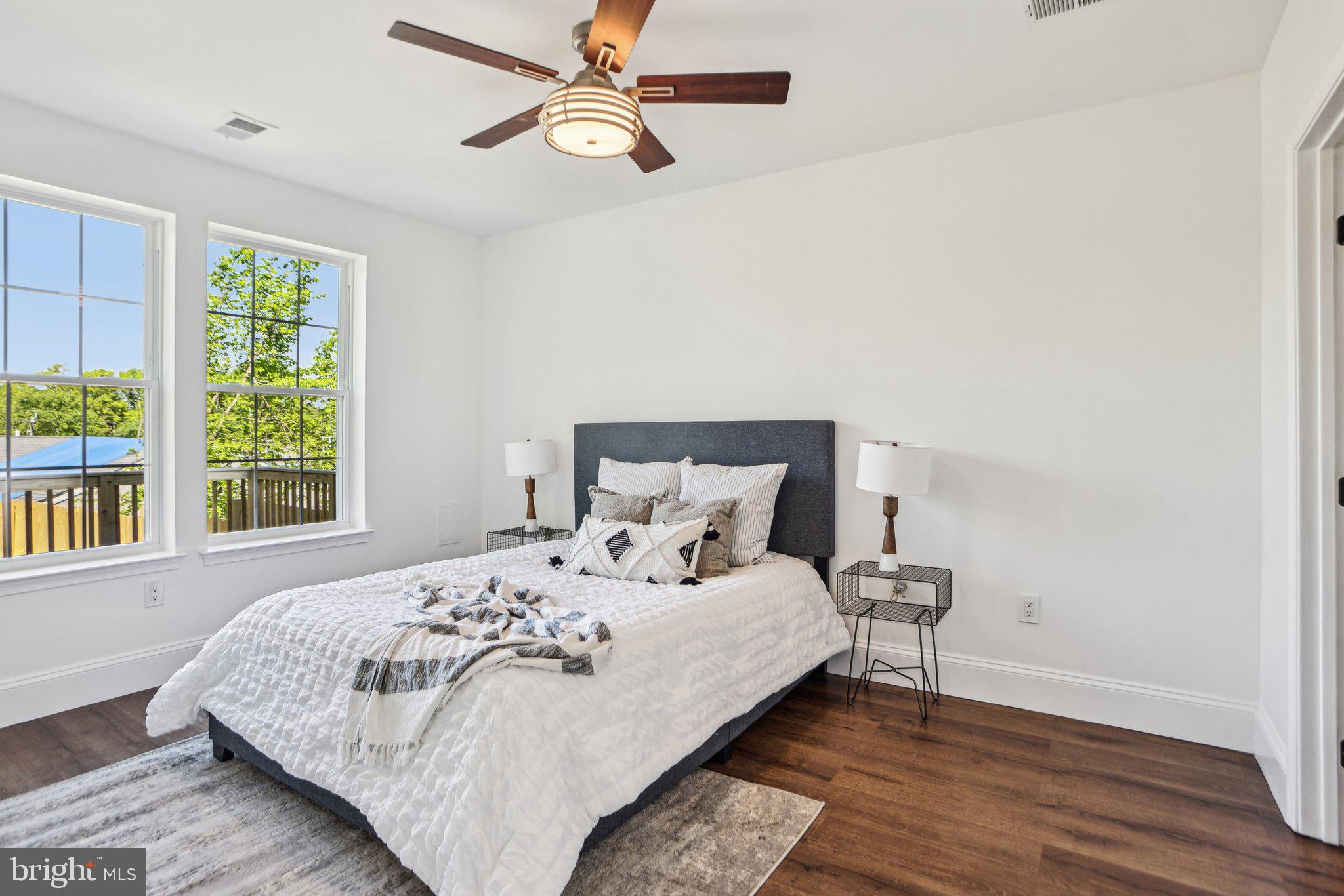 322 56th Street Northeast Washington, DC 20019 - Photo 43 of 57 a large bed sitting in a bedroom next to a window