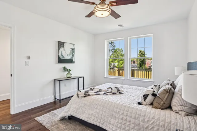 a view of house with deck and wooden floor