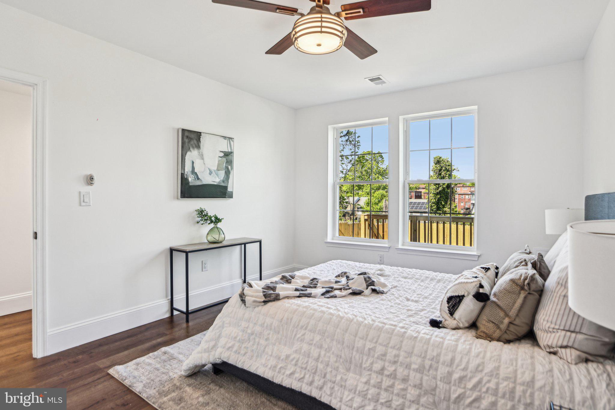 322 56th Street Northeast Washington, DC 20019 - Photo 45 of 57 a bedroom with a bed and wooden floor