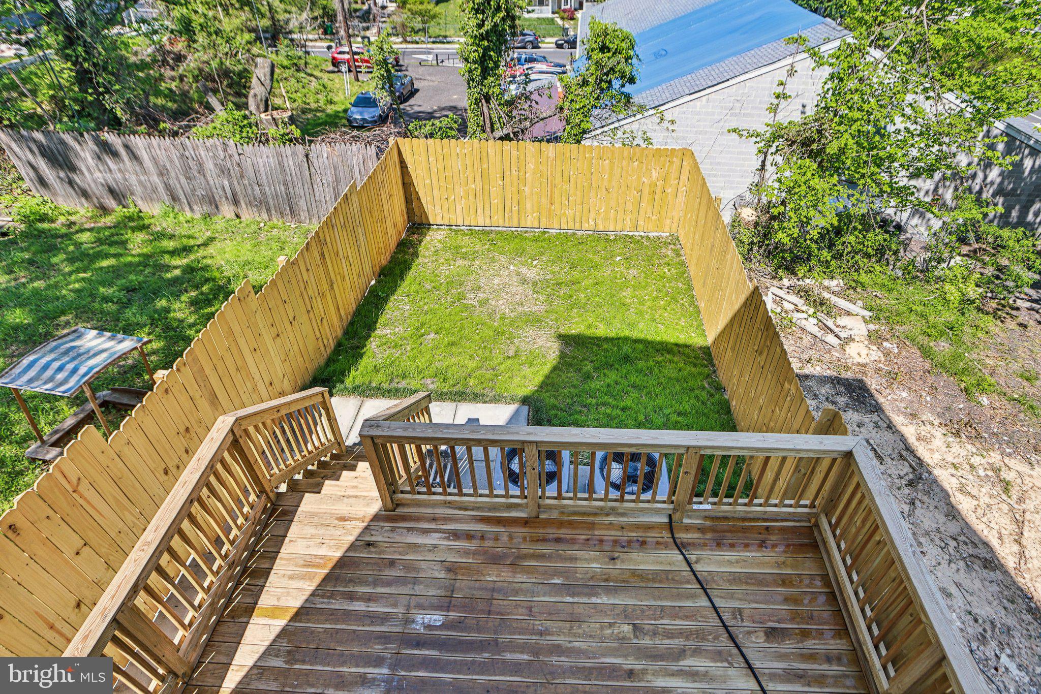 322 56th Street Northeast Washington, DC 20019 - Photo 47 of 57 a view of balcony with wooden floor and outdoor seating