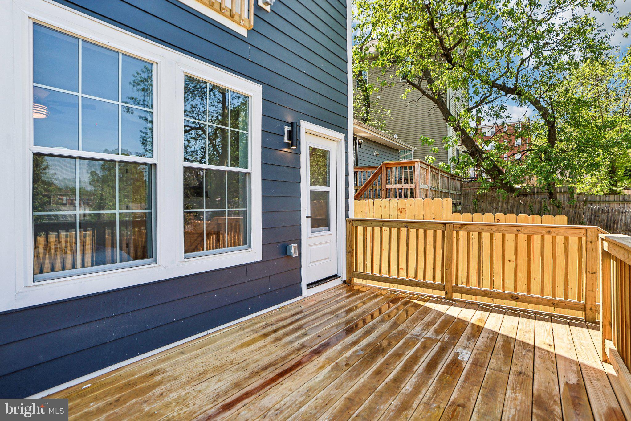 322 56th Street Northeast Washington, DC 20019 - Photo 49 of 57 a view of house with deck and wooden floor