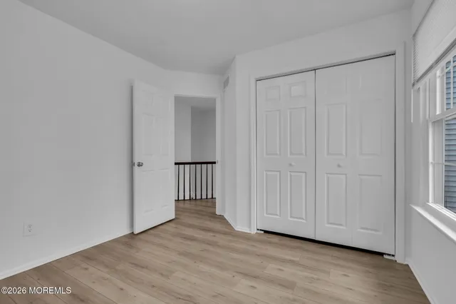 a view of a livingroom with wooden floor