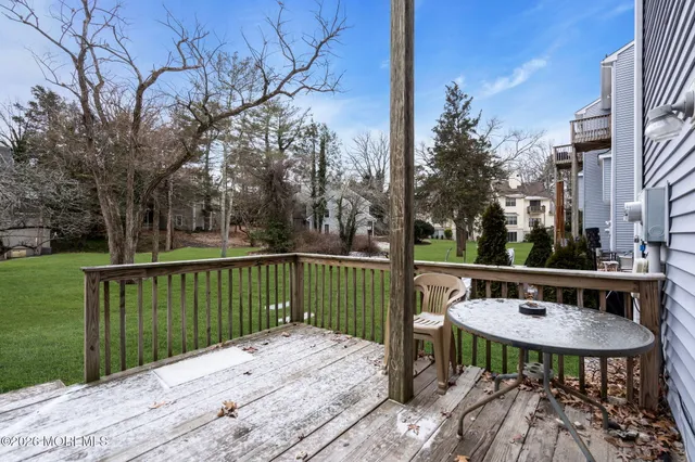 a view of a table and chairs on the roof deck
