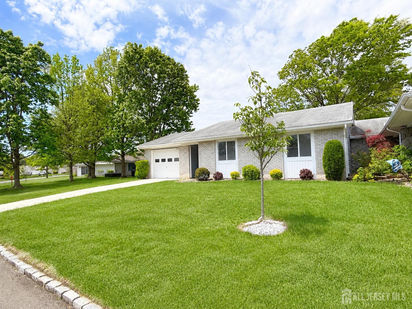 621 A Deal Road Monroe Township, NJ 08831 - Photo 3 of 27 a view of a house with a back yard