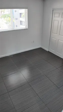 a bathroom with a granite countertop toilet a sink and bathtub