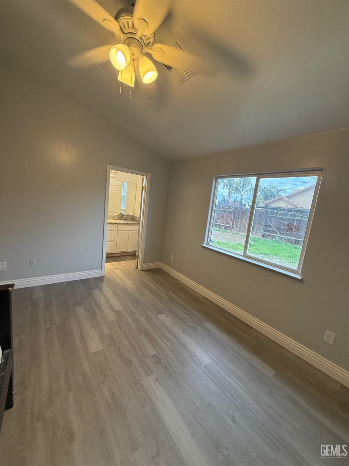 Undisclosed Address Bakersfield, CA 93313 - Photo 36 of 37 wooden floor in an empty room with a window