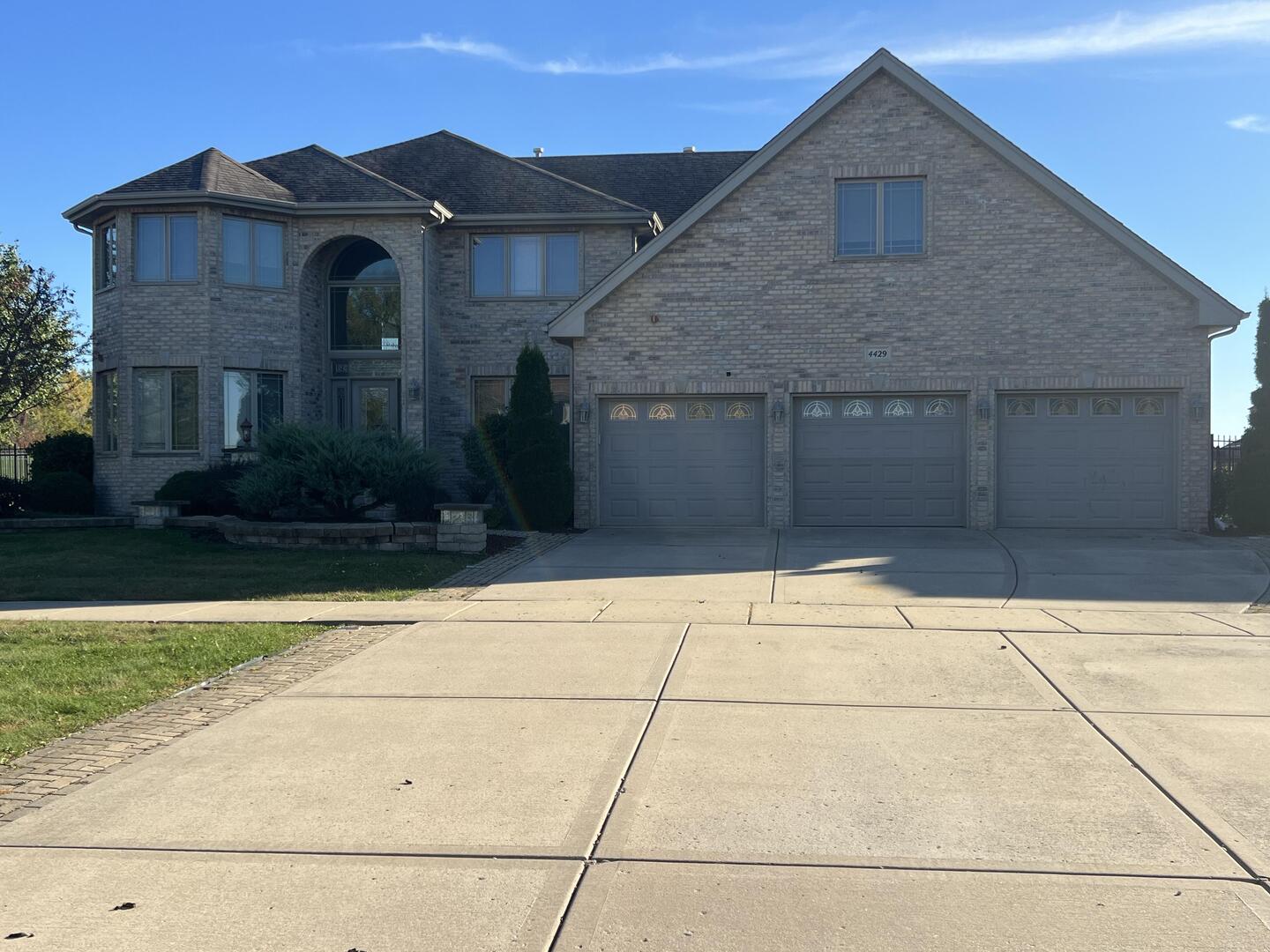 4429 203rd Street Matteson, IL 60443 - Photo 1 of 29 a front view of a house with garden