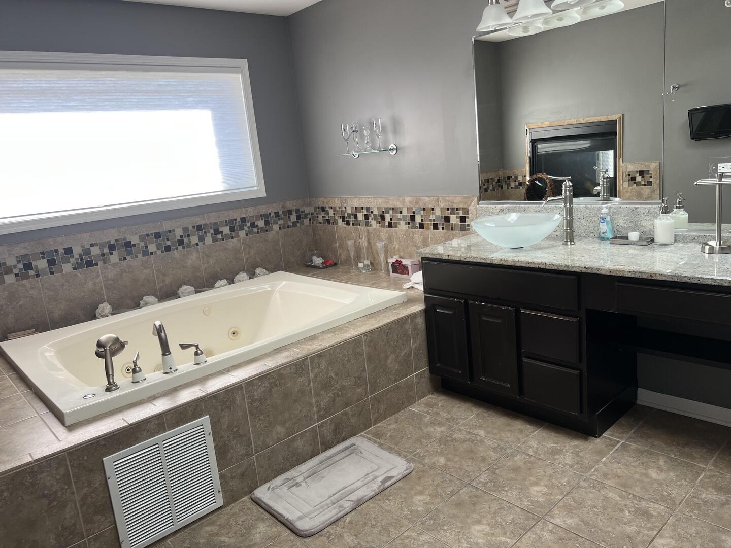 4429 203rd Street Matteson, IL 60443 - Photo 17 of 29 a spacious bathroom with a tub sink and mirror