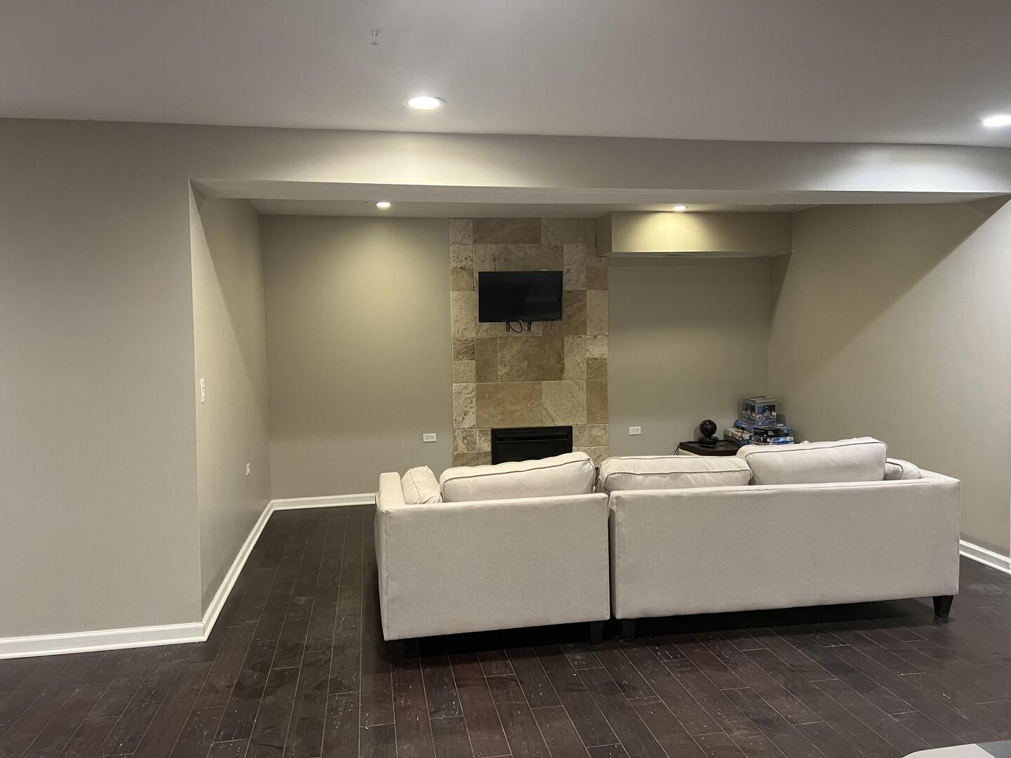 4429 203rd Street Matteson, IL 60443 - Photo 24 of 29 a living room with a couch and a wooden floor