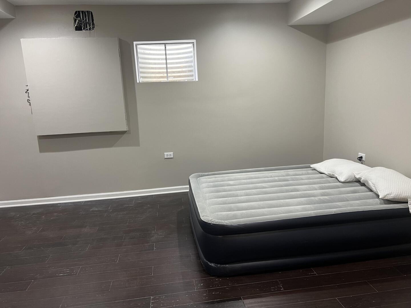 4429 203rd Street Matteson, IL 60443 - Photo 26 of 29 a bedroom with a bed and wooden floor