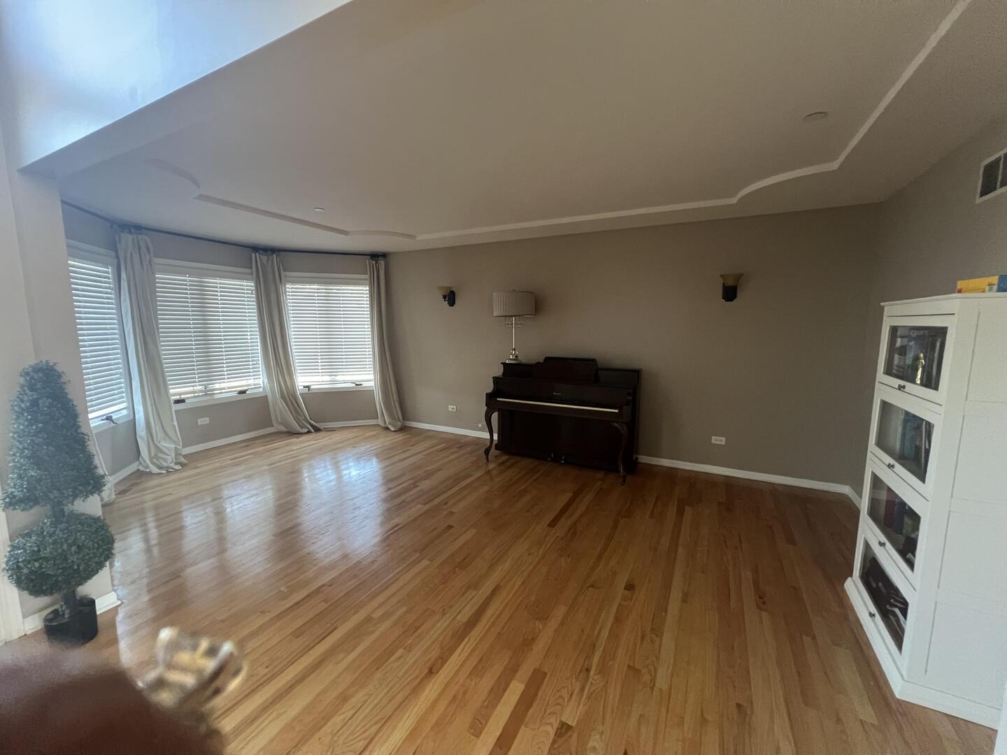 4429 203rd Street Matteson, IL 60443 - Photo 3 of 29 a view of an empty room with wooden floor and a window