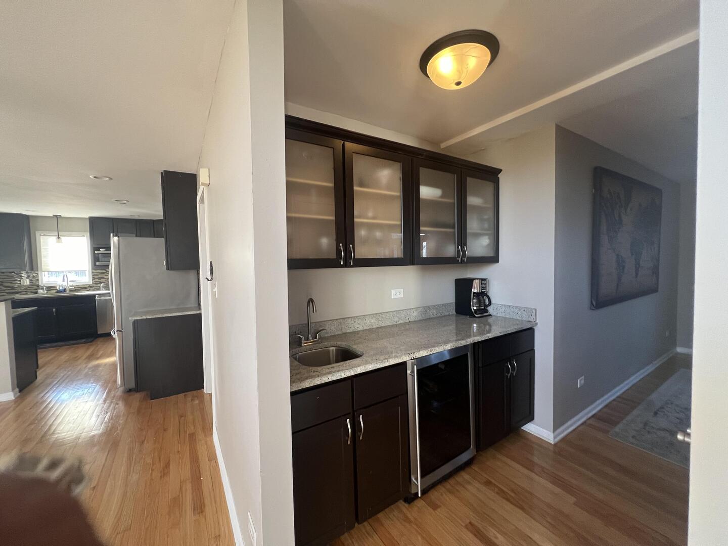 4429 203rd Street Matteson, IL 60443 - Photo 8 of 29 a kitchen with a sink and a refrigerator