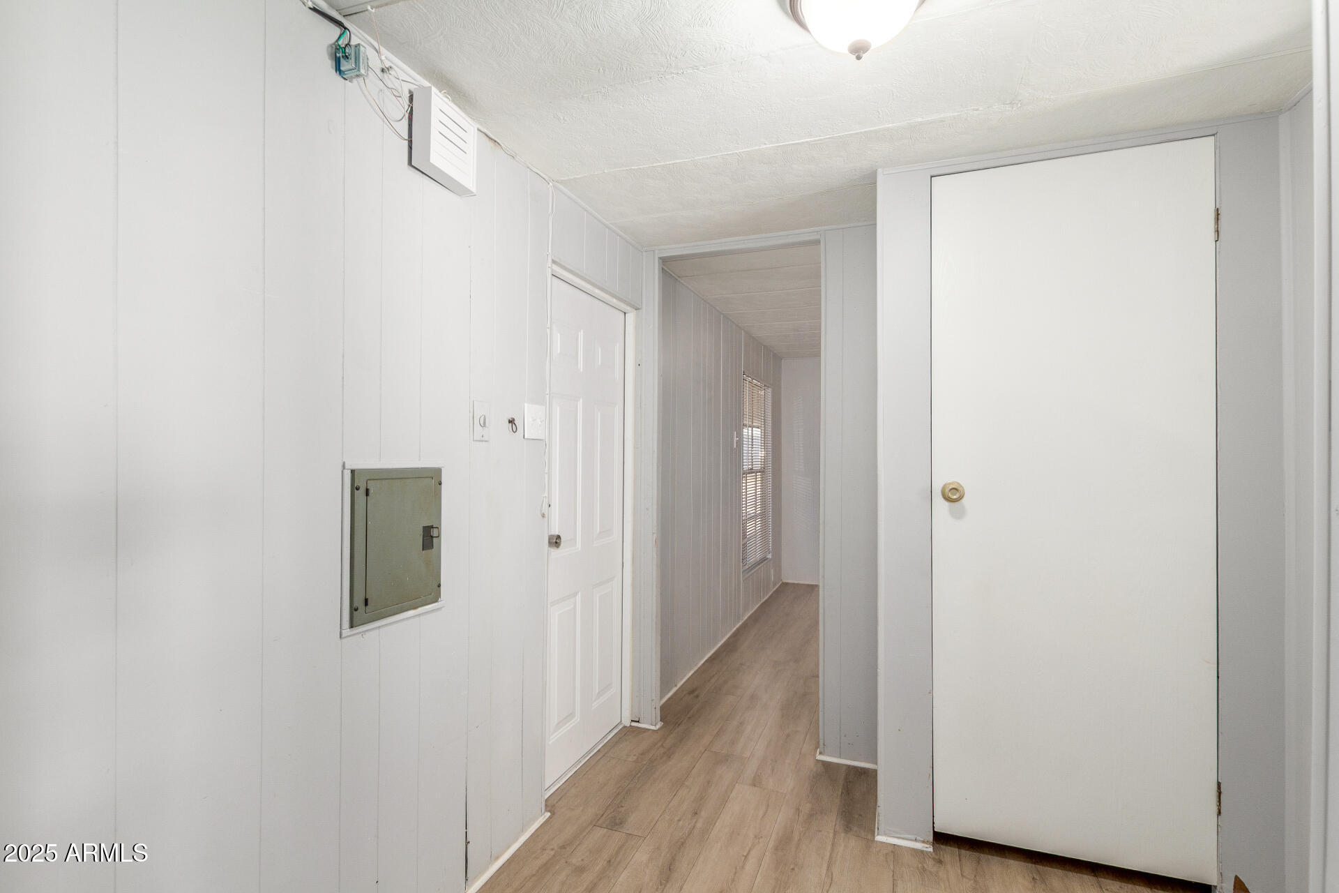 16225 North Cave Creek Road, Unit 140 Phoenix, AZ 85032 - Photo 21 of 32 a view of a hallway with wooden floor